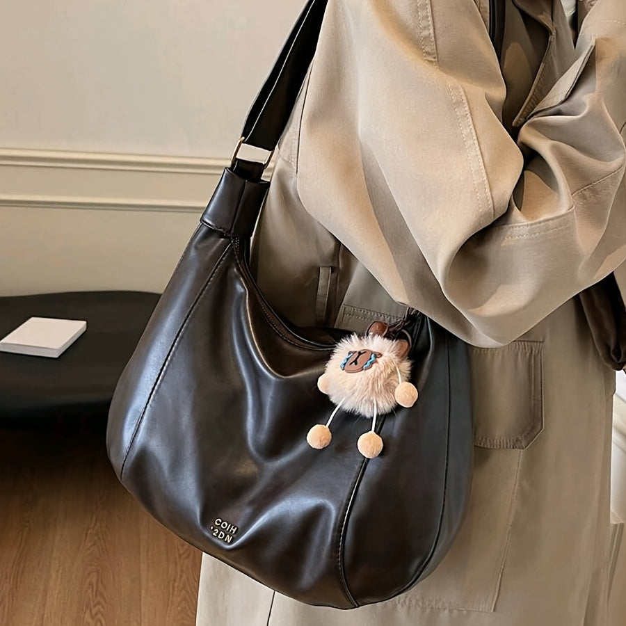 Sac bandoulière vintage élégant pour femmes – grand format, bandoulière réglable, charm lion en peluche, fermeture zippée, détails sur les bords, simili cuir café, marron clair ou noir, idéal pour travail, trajets et sorties