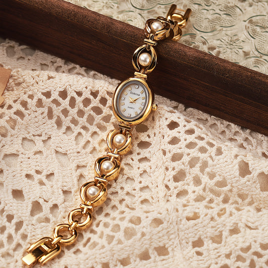 Montre femme vintage, bracelet en alliage doré, mouvement quartz, cadran ovale, détails élégants, cadeau idéal pour la fête des mères, la Saint-Valentin ou occasions spéciales