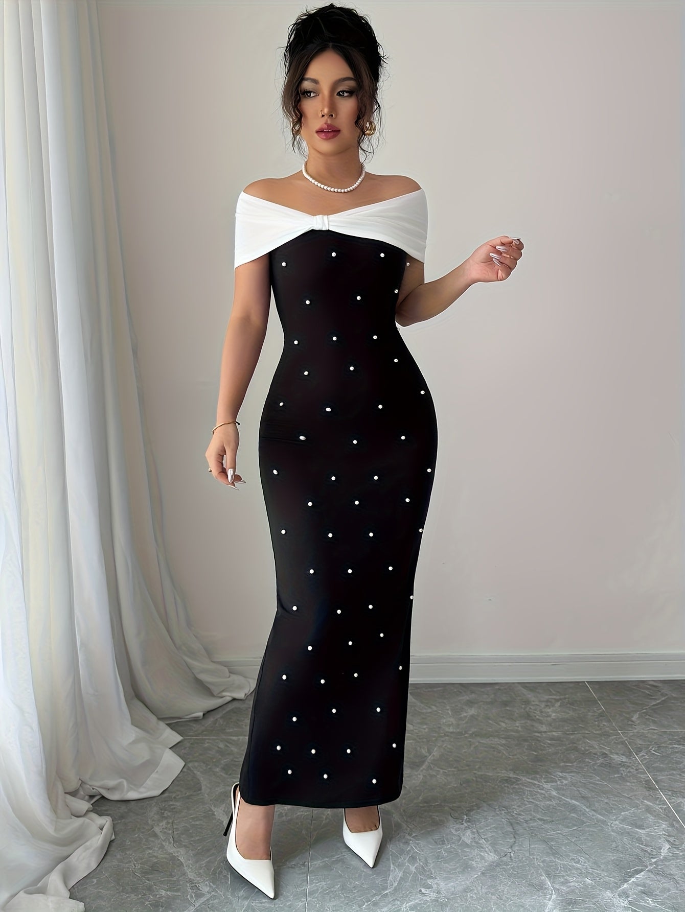 A Black Beaded Off-Shoulder Dress Featuring Elegant Heavy Embellishments, Perfect for Banquets And Dates, Designed to Create a Effect And Showcase a Goddess-Like Silhouette.