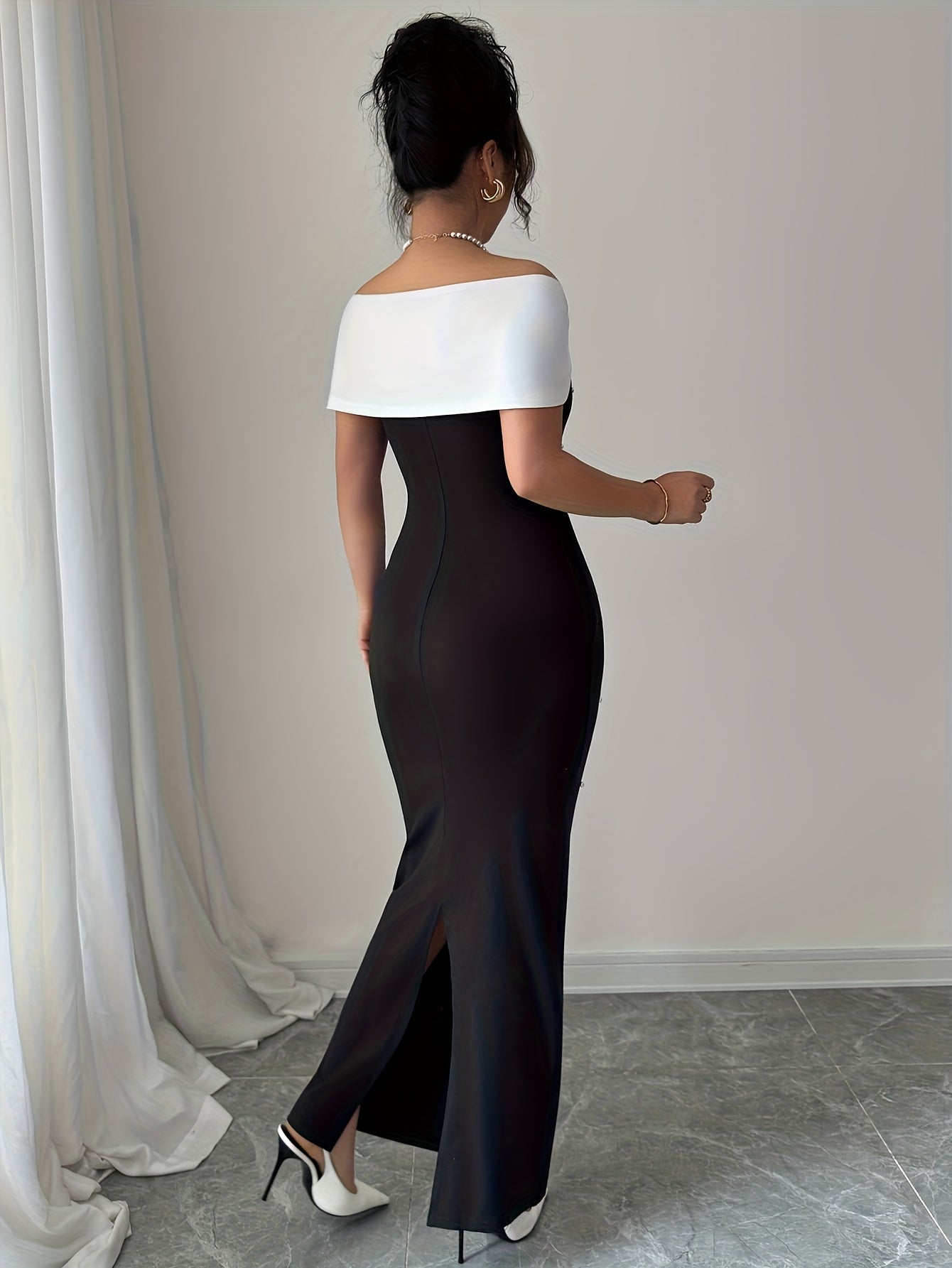 A Black Beaded Off-Shoulder Dress Featuring Elegant Heavy Embellishments, Perfect for Banquets And Dates, Designed to Create a Effect And Showcase a Goddess-Like Silhouette.