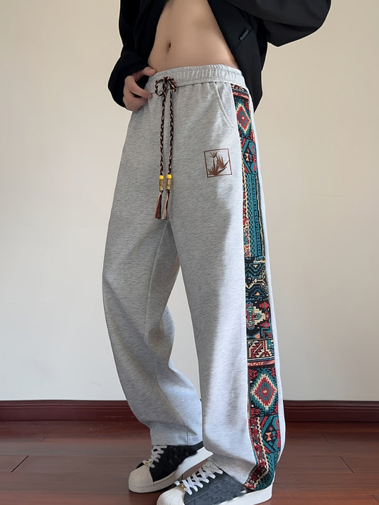 Joggers à motif tribal pour homme – taille élastique à cordon, coupe ample jambe droite, motif multicolore (rouge/bleu/vert/orange/jaune), tissu non extensible, lavable à la main, style ethnique décontracté automne/hiver