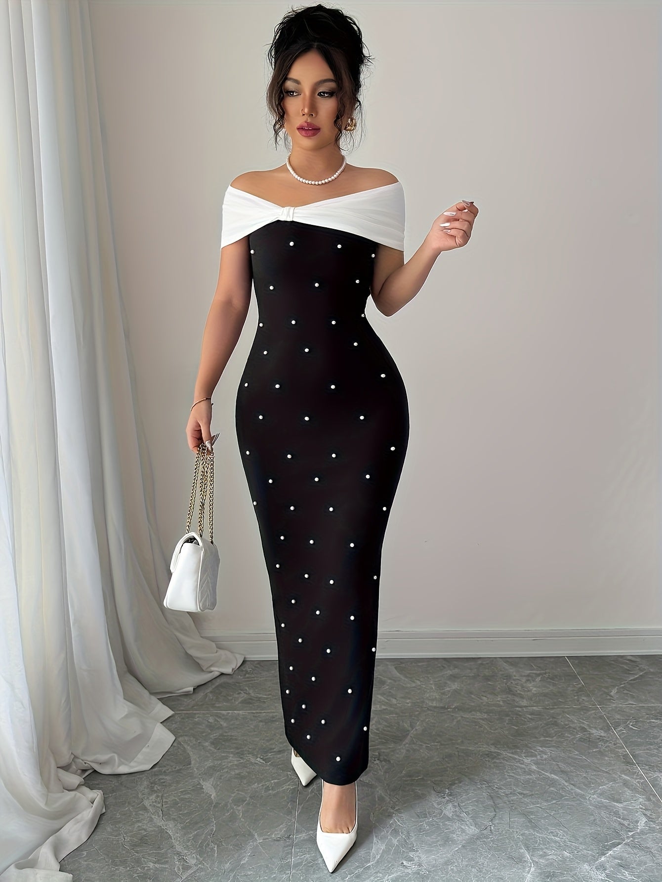 A Black Beaded Off-Shoulder Dress Featuring Elegant Heavy Embellishments, Perfect for Banquets And Dates, Designed to Create a Effect And Showcase a Goddess-Like Silhouette.