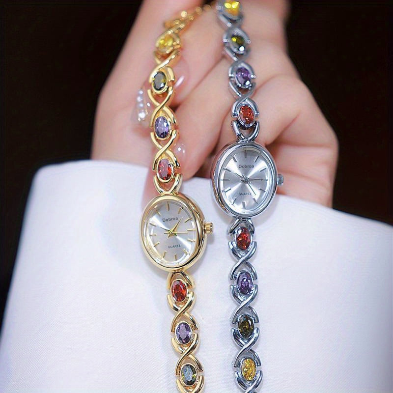 Montre Femme Élégante –Boîtier Ovale Ton Doré avec Strass Synthétiques Colorés, Cadran Blanc Analogique, Style Bracelet Classique et Luxueux, Cadeau Idéal pour Noël, Saint-Valentin ou Autres Occasions