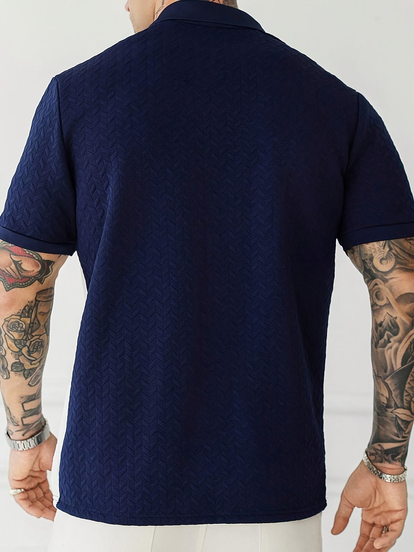 Men'S Short-Sleeve Polo Shirt with a Patchwork Design, Featuring Buttons And a Textured Knit, Perfect for Casual Summer Wear with a Stylish And Comfortable Fit.