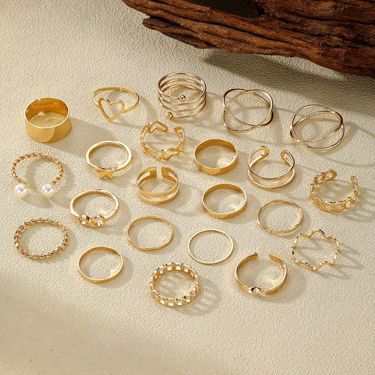 A Set of 22 Women'S Rings in Golden Color Featuring Vintage, Fashionable, Minimalist, And Elegant Designs with Hollow Heart And Spiral Shapes. This Golden Ring Set Is Suitable for Daily Wear, Vacations, Parties, And Weddings