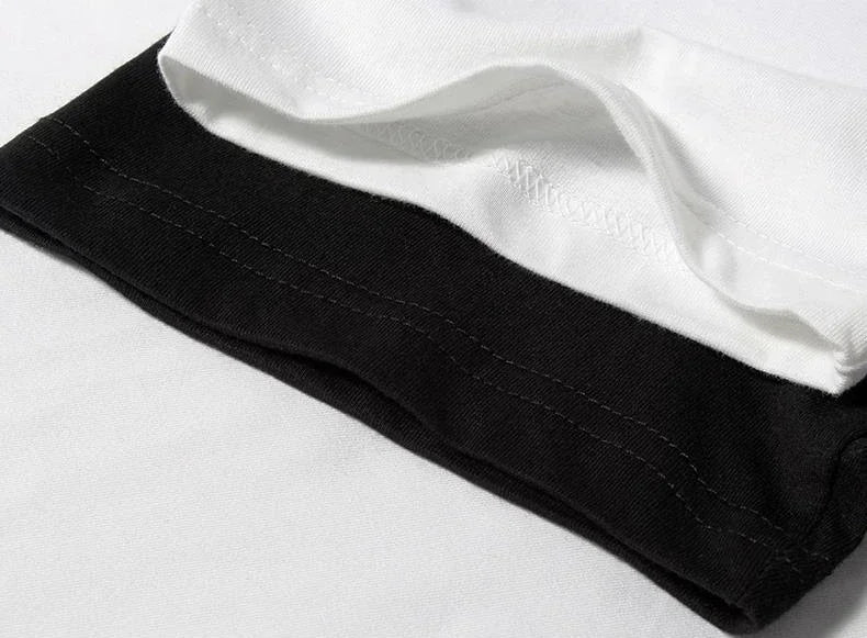 Un T-shirt élégant à manches courtes et col rond, ample, décontracté et polyvalent, imprimé