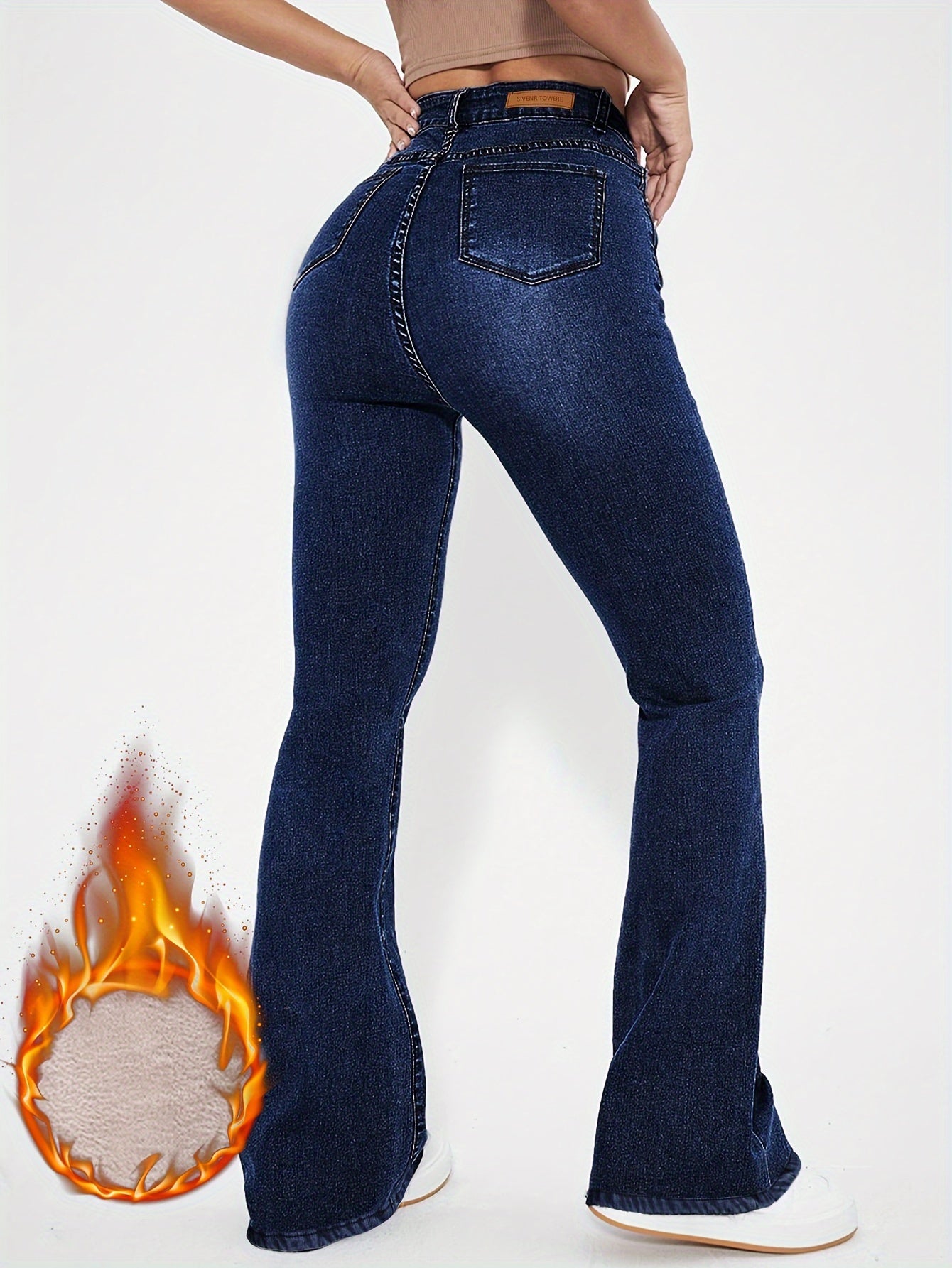 Pantalon en jean bleu délavé taille haute, doublé peluche, coupe évasée, fermeture éclair et bouton, style décontracté