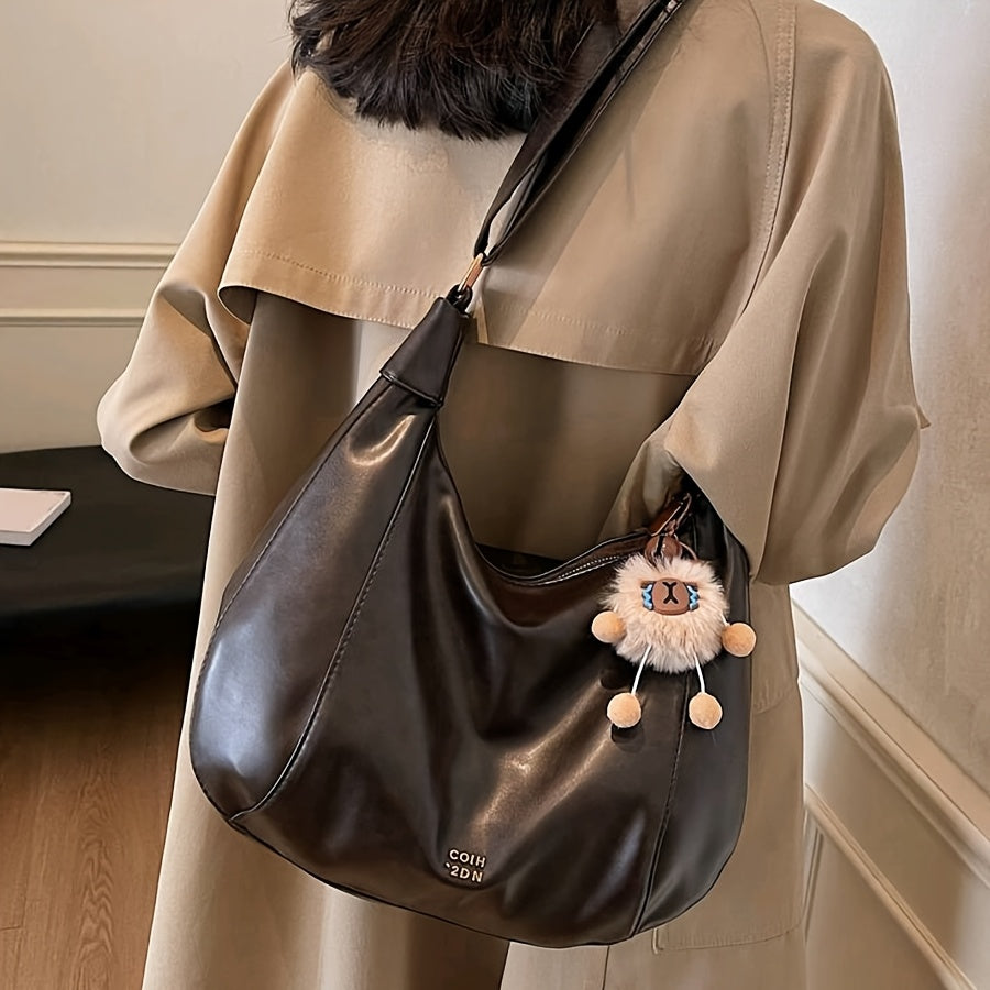 Sac bandoulière vintage élégant pour femmes – grand format, bandoulière réglable, charm lion en peluche, fermeture zippée, détails sur les bords, simili cuir café, marron clair ou noir, idéal pour travail, trajets et sorties