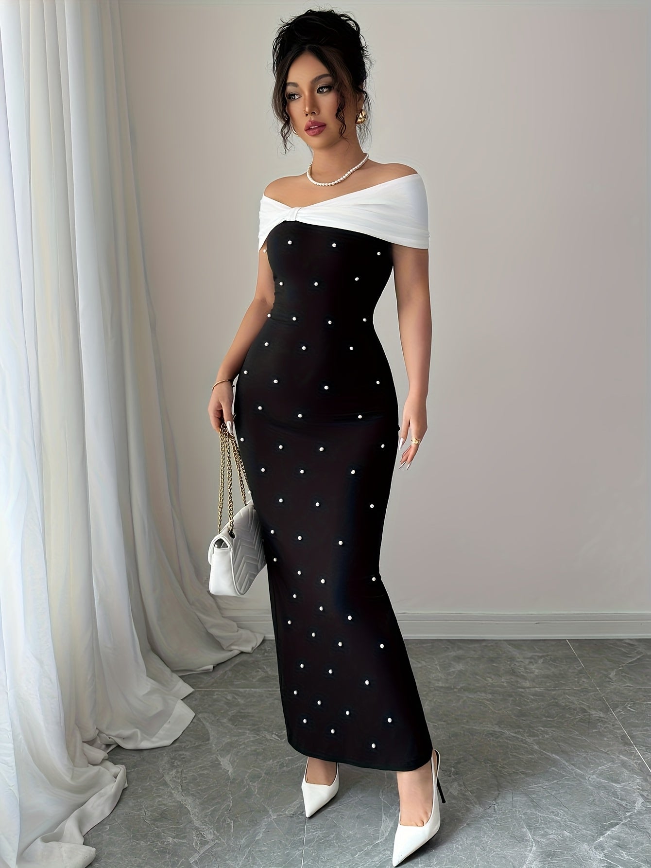 A Black Beaded Off-Shoulder Dress Featuring Elegant Heavy Embellishments, Perfect for Banquets And Dates, Designed to Create a Effect And Showcase a Goddess-Like Silhouette.