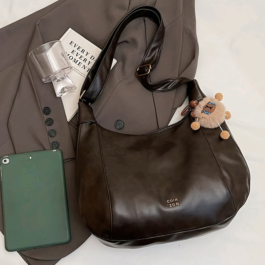 Sac bandoulière vintage élégant pour femmes – grand format, bandoulière réglable, charm lion en peluche, fermeture zippée, détails sur les bords, simili cuir café, marron clair ou noir, idéal pour travail, trajets et sorties