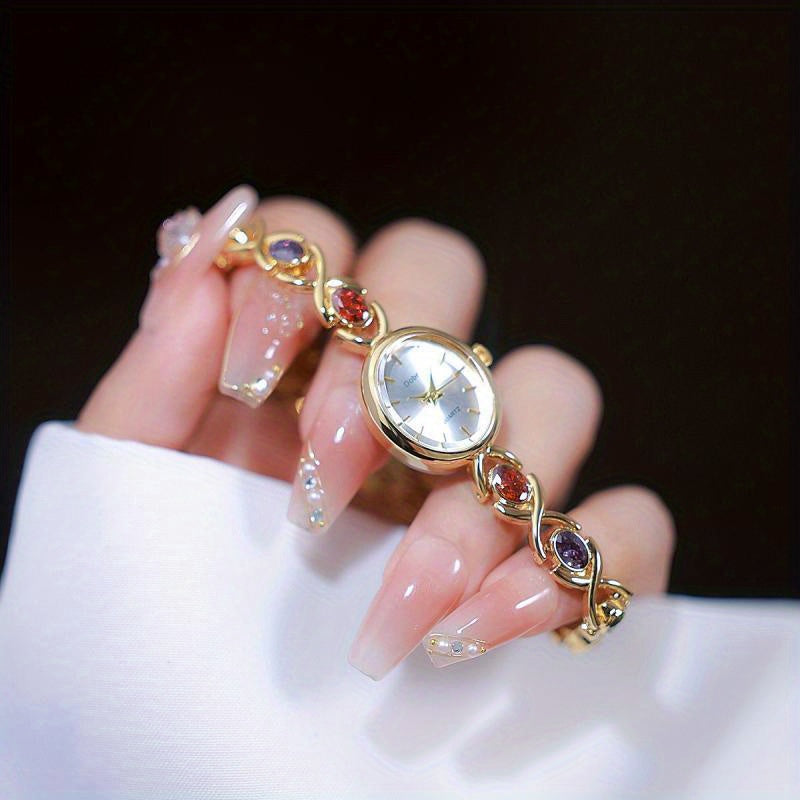 Montre Femme Élégante –Boîtier Ovale Ton Doré avec Strass Synthétiques Colorés, Cadran Blanc Analogique, Style Bracelet Classique et Luxueux, Cadeau Idéal pour Noël, Saint-Valentin ou Autres Occasions