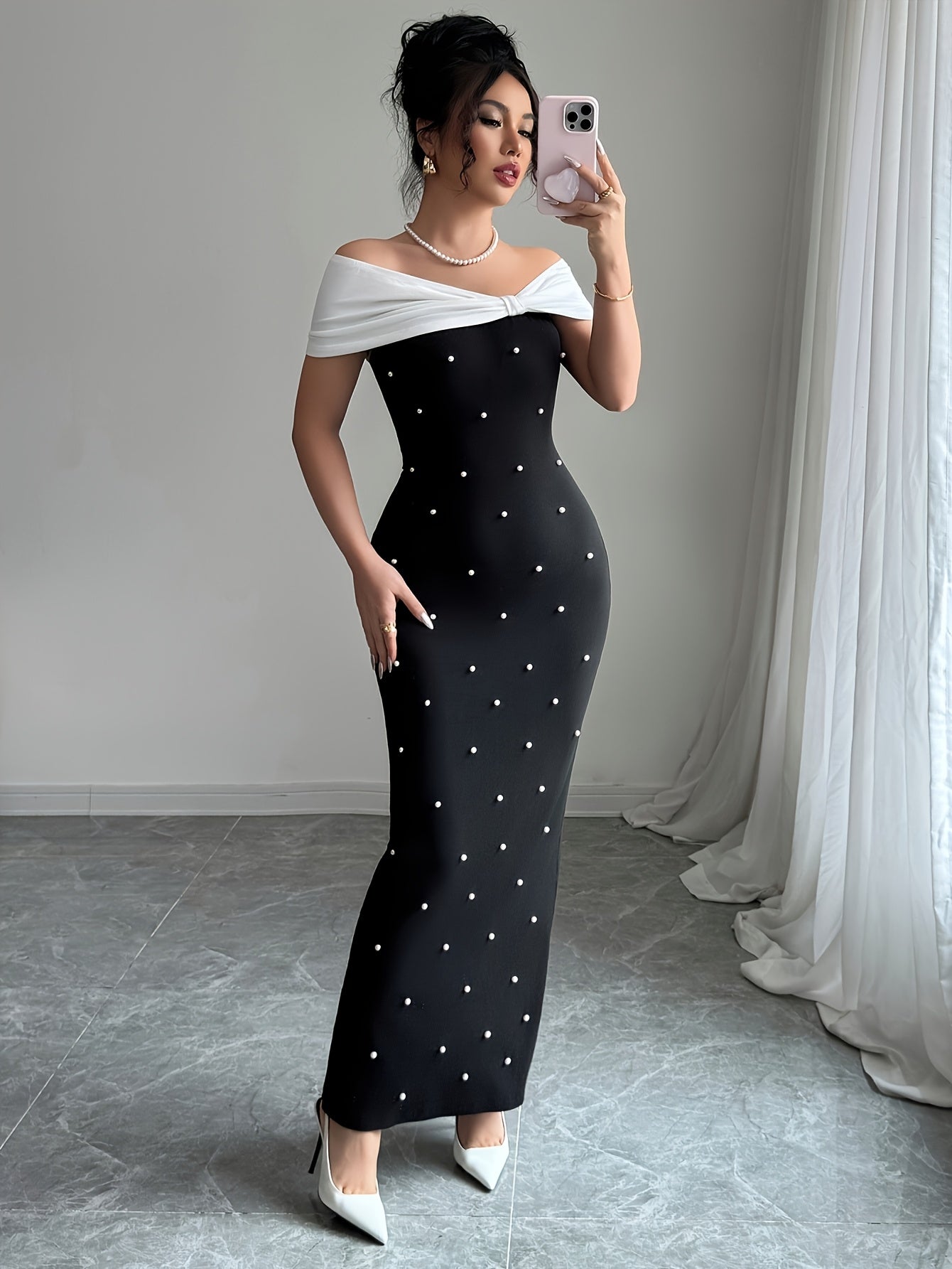 A Black Beaded Off-Shoulder Dress Featuring Elegant Heavy Embellishments, Perfect for Banquets And Dates, Designed to Create a Effect And Showcase a Goddess-Like Silhouette.
